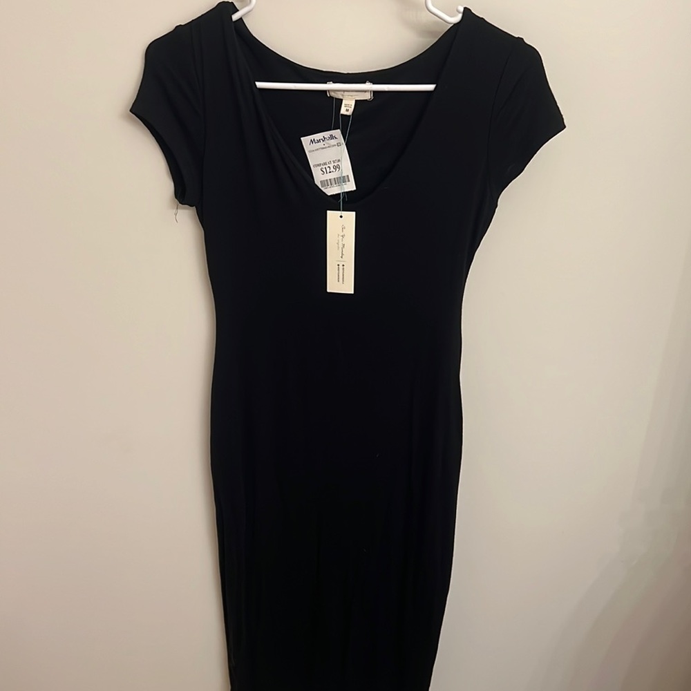 See you Monday brand. Size medium. Below knee, curve hugging black dress